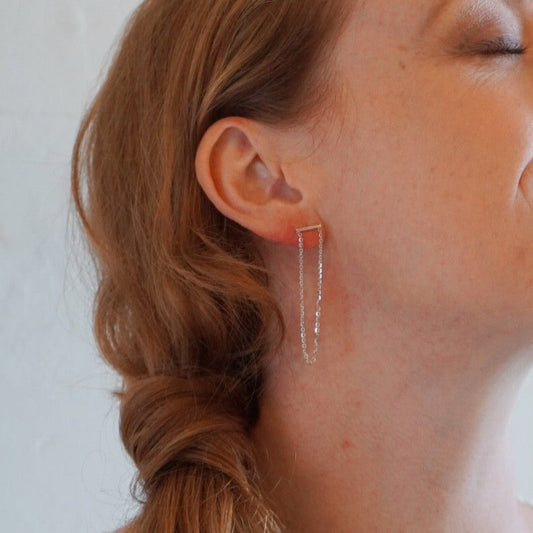 chain hanging from silver bar earrings brand xibalba