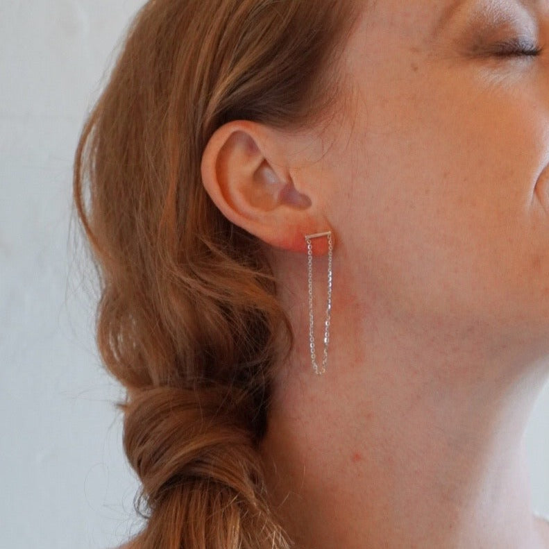 chain hanging from silver bar earrings brand xibalba