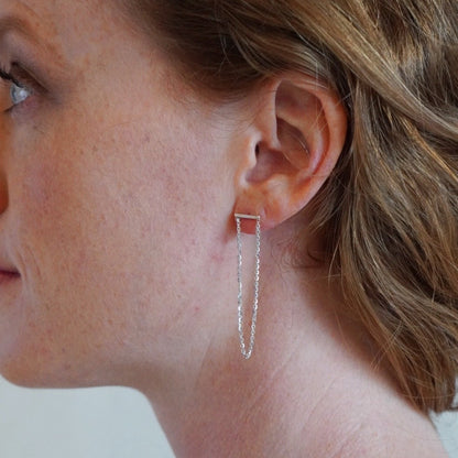 chain hanging from silver bar earrings brand xibalba